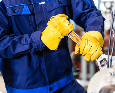 technician fixing machine using wrench