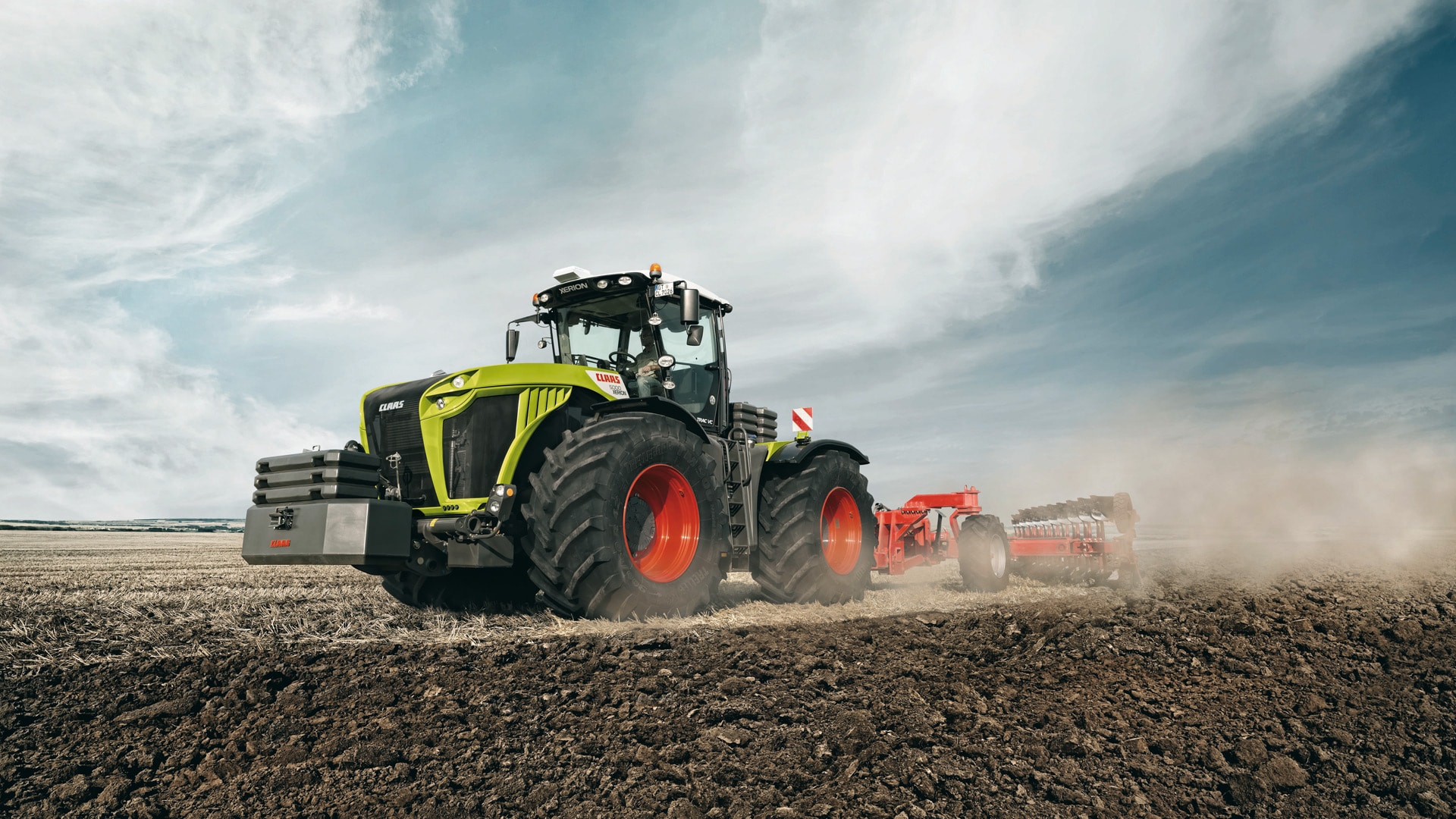 CLAAS tractor being operated in field