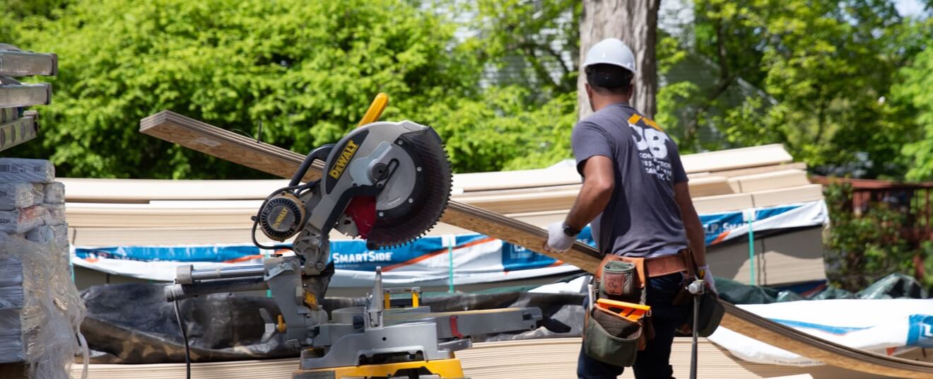 Technician working with wood and saw equipment