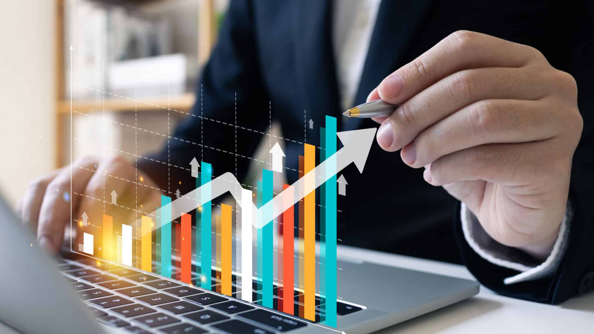 Virtual bar chart with arrow up. Man in background with pen pointing at it