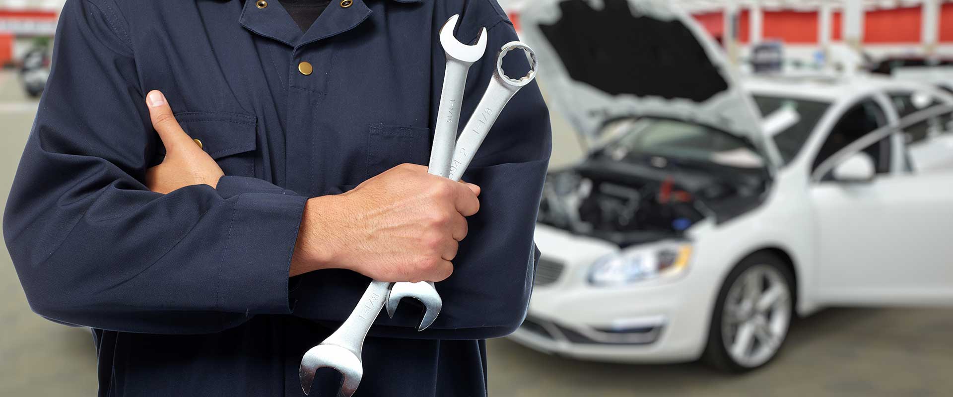 person holding wrenches
