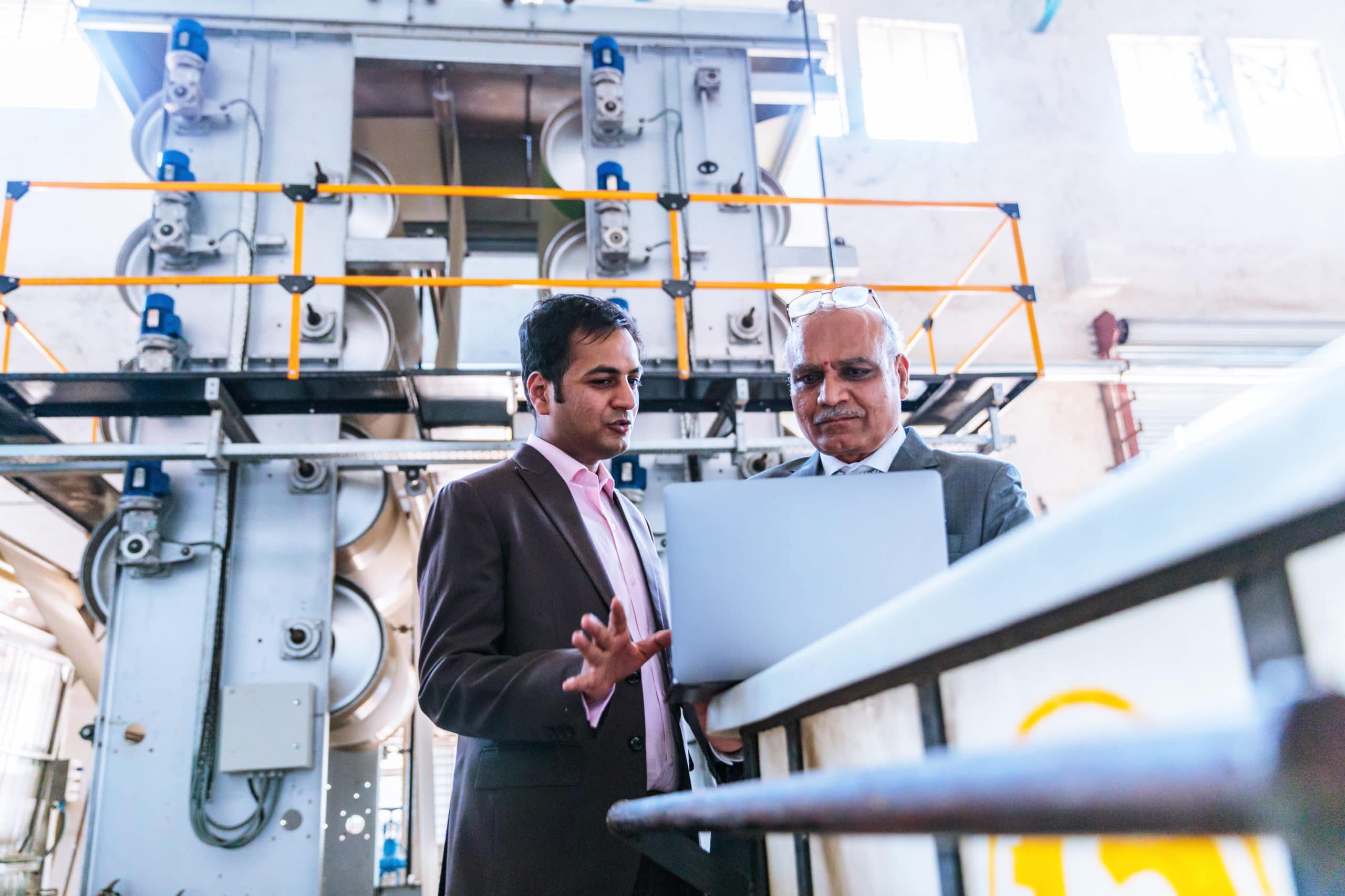 Business men in a factory