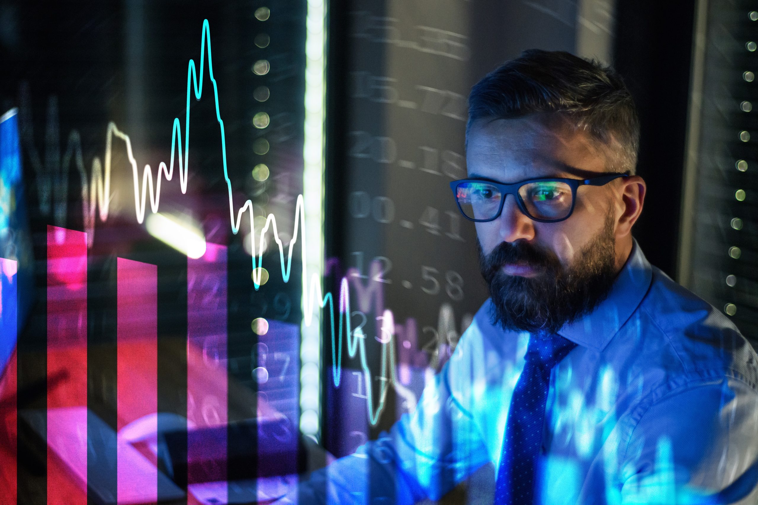 businessman with financial graphs
