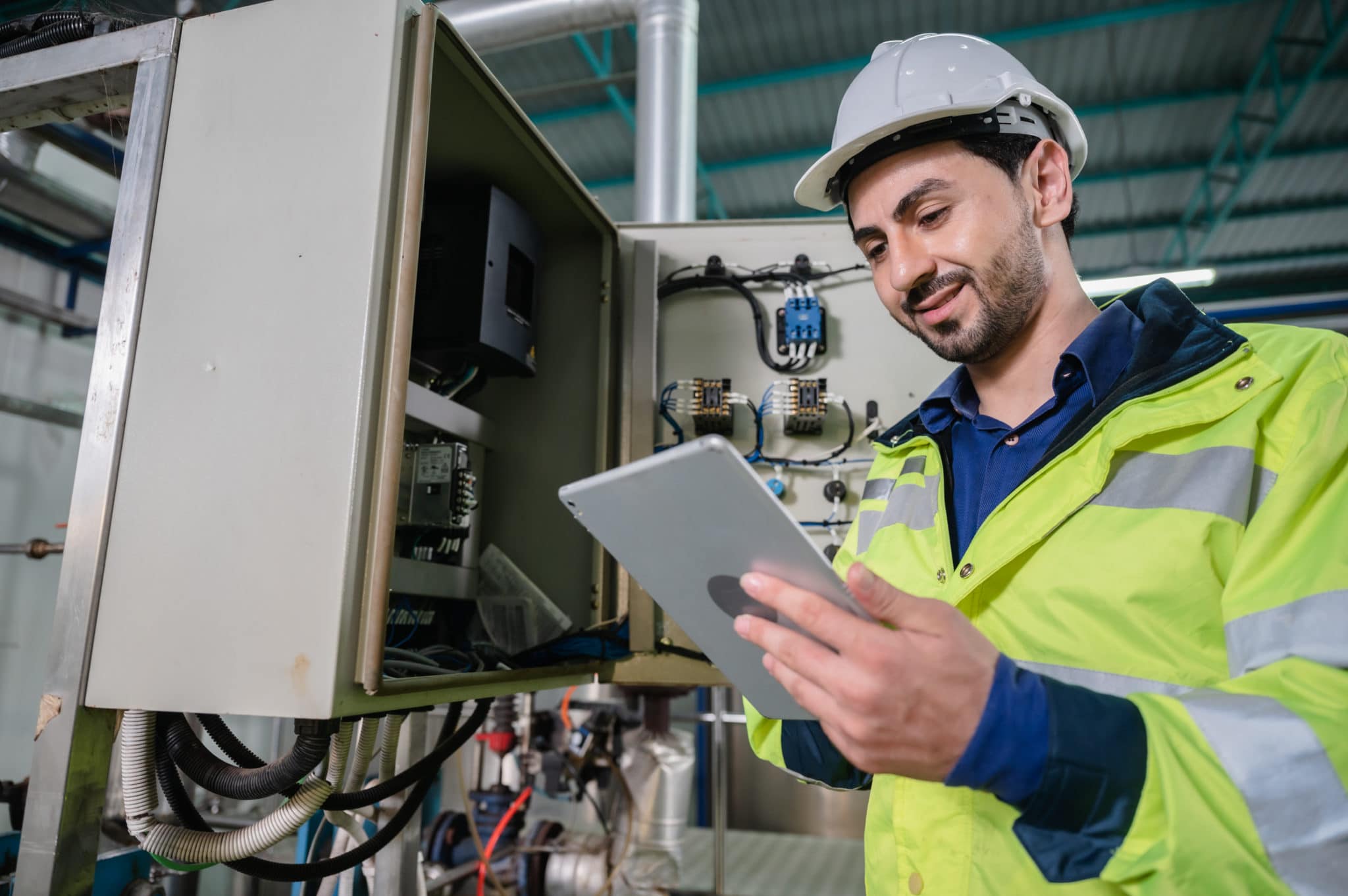 Technician using tablet and service knowledge